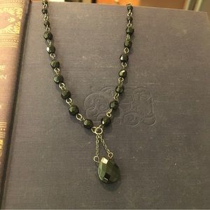 Black faceted bead necklace.